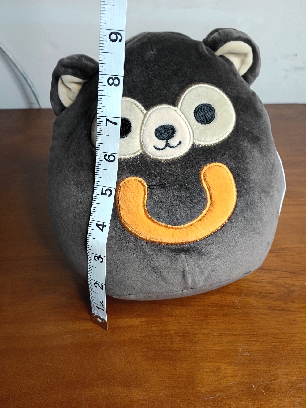 Squishmallows Plush Bear Soft Toy in Dark Gray with Orange Smile